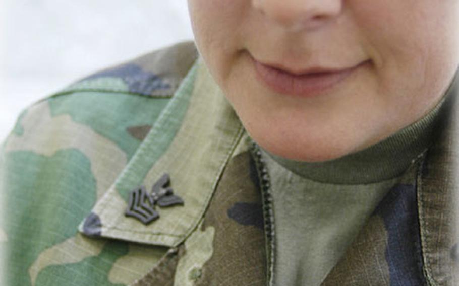 Navy Petty Officer 1st Class Karen Carter looks at a reading during a class at Camp Kinser. She's near completion for her Fleet Marine Force Enlisted Warfare Badge.