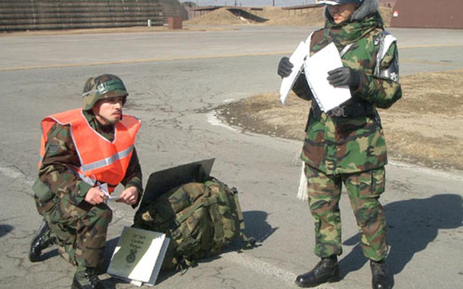 Members of the 51st Figher Wing go through a series of cordon drills during an Osan Air Base inspection last week.
