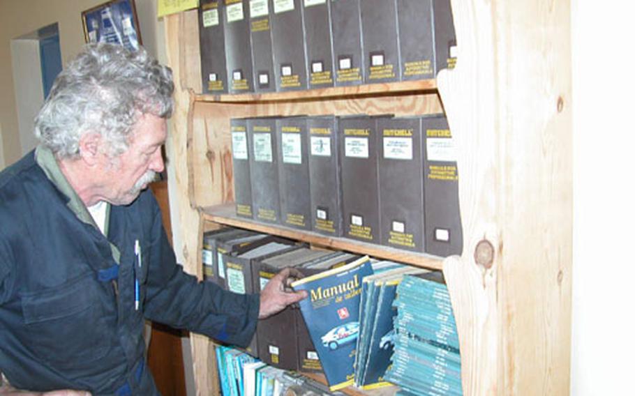 Technical manuals for hundreds of cars have been collected and cataloged by Yuri Durnovo, who has volunteered at the Auto Hobby Shop at Naval Station Rota, Spain, since it opened more than 20 years ago.