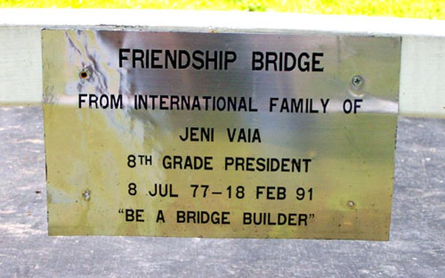 A plaque on "Jeni's Bridge" at Camp Zama exhorts students to work on building and keeping stronger relationships. Chris Vaia, Jeni's father, wants to build another bridge at Yongsan Garrison.