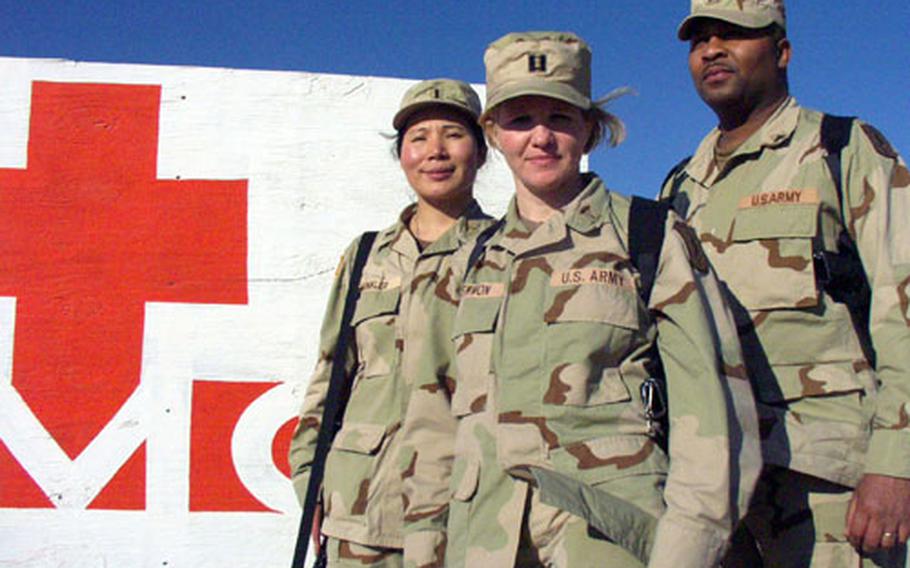 From left, 1st Lt. Kyong Winkler, Capt. Michelle Stewmon and Sgt. Dexter Harris are nurses with the Würzburg, Germany-based 67th Combat Support Hospital, which recently deployed to Iraq for a year. All three said goodbye to active-duty spouses who had just returned from yearlong Iraq tours. In Europe, dual-military deployments are hitting hardest this year in the Würzburg area.