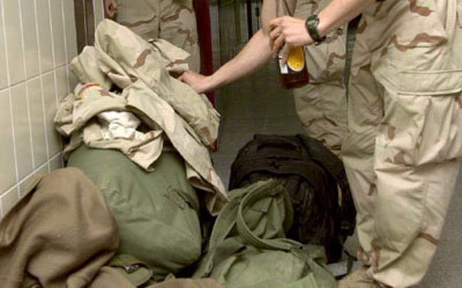 For single soldiers returning to Europe from the Middle East, “welcome home” means returning to the barracks with family still far away.