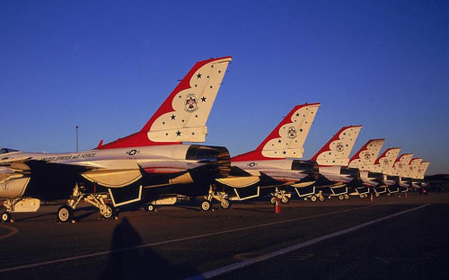 A distinctive paint job adorns the tail sections of these F-16 jets belonging to the U.S. Air Force Air Demonstration Squadron, the Thunderbirds. Squadron recruiters will be at Osan Air Base, South Korea, next week seeking enlisted airmen as applicants for job openings within the elite squadron. The Thunderbirds are based at Nellis Air Force Base, Nev.