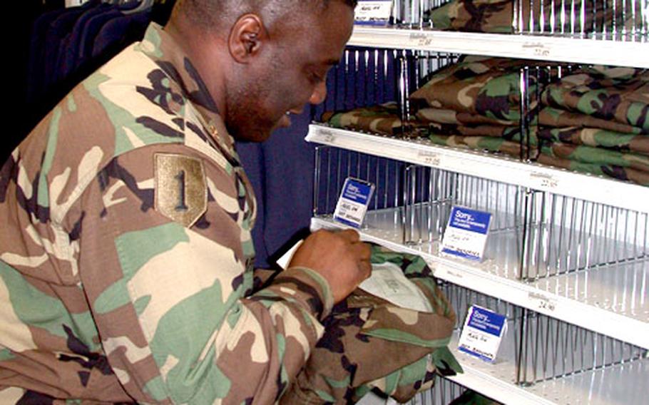 Maj. Keith Gafford, a program manager in the Army’s logistics branch (G-4), finds as many “back order” signs as he does jackets and pants among the woodland temperate and enhanced hot weather BDUs at the Military Clothing Sales store in the Pentagon.