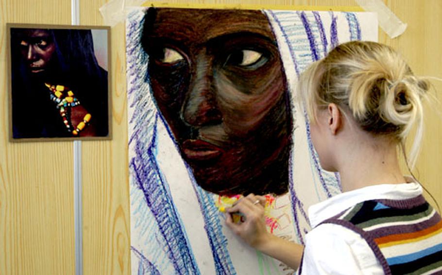 Sara Weber, a SHAPE senior, works on a piece in the "Oil Pastels" workshop Tuesday at Creative Connections.