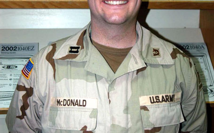 Capt. Ty McDonald, officer in charge of the 1st Armored Division's Baghdad Tax Center.