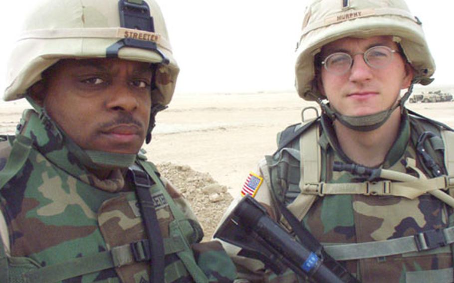 Sgt. 1st Class Michael Streeter, 34, of Birmingham, Ala., and 1st Lt. Fran Murphy, 23, of Lexington, Ky., NCOIC and commander of 3rd platoon, Bravo Company, 1st Battalion, 77th Armor. The tank platoon currently is attached to Bravo Company, Task Force 1-18, under the 1st Infantry Division.