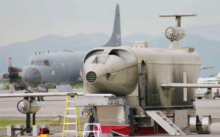 A Mobile Aircraft Fire Trainer (MAFT) sits on the NAS Sigonella flightline. The base fire department recently obtained the MAFT, which will be used to safely train firefighters on aspects of fighting aircraft fires. The MAFT can simulate such things as engine fires, wheel fires, interior fires, and tire blowouts.