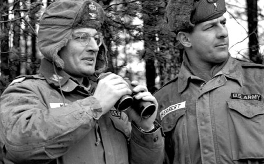 Col. Theodore Mataxis, left, and 1st Lt. Anthony Herbert watch the Rangers taking part in Winter Shield II.