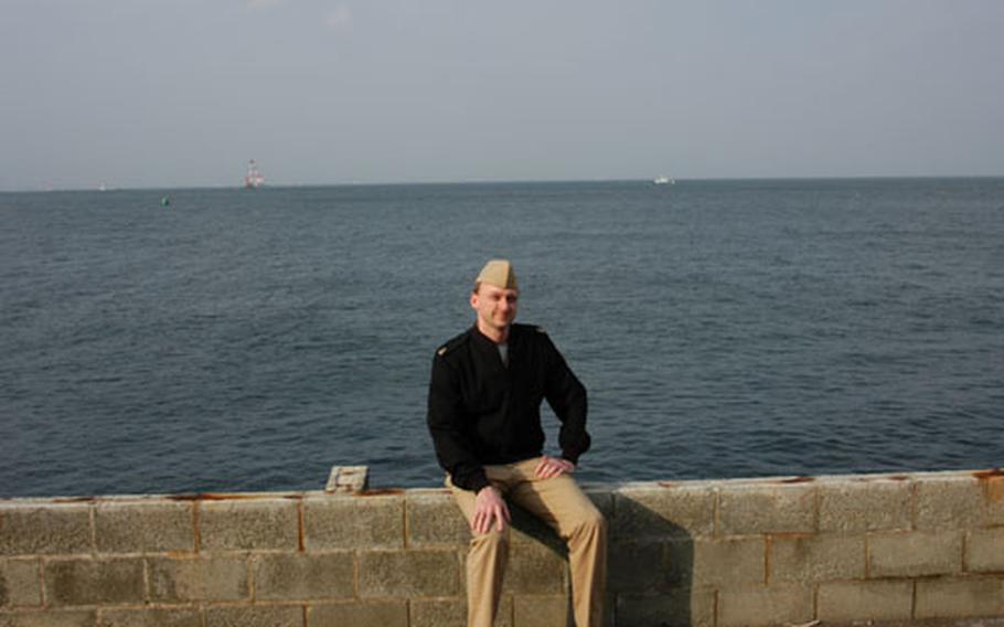 Chief Petty Officer Robert Williamson, pictured at Yokosuka Naval Base, Japan, on Thursday, has spent half his life with the U.S. Navy in Japan. But he said he agrees with a new policy restricting how many overseas tours a sailor can do, and plans to accept his next tour in the United States.