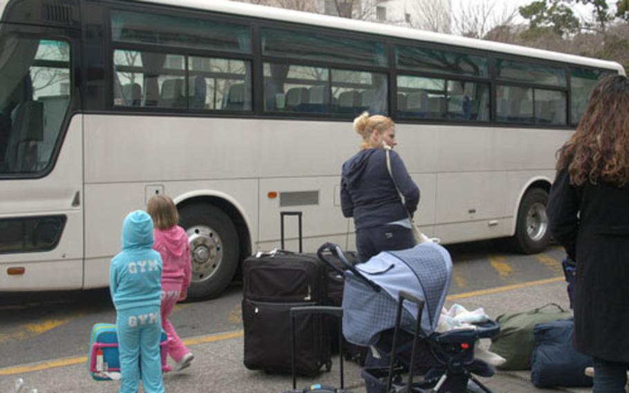 Kristi Hawthorn and her daughters, from left, Dakota and Leigh Ann,were bound for Alabama on Friday morning at Yokosuka Naval Base, Japan. After three years in Japan, Hawthorn was happy to be heading home.