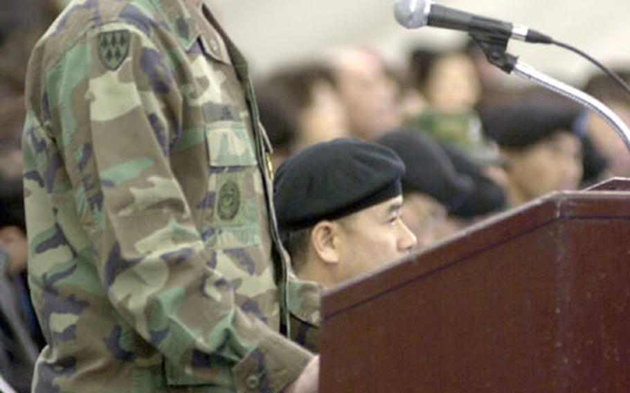 Command Sgt. Maj., Timothy D. Lane, commandant of the KATUSA Training Academy at Camp Jackson, South Korea, speaks Thursday at the graduation ceremony for the KATUSAs as their friends and family look on. The relationship between the U.S. Army and the Korean Augmentees to the US Army is like no other in the Army, he said.