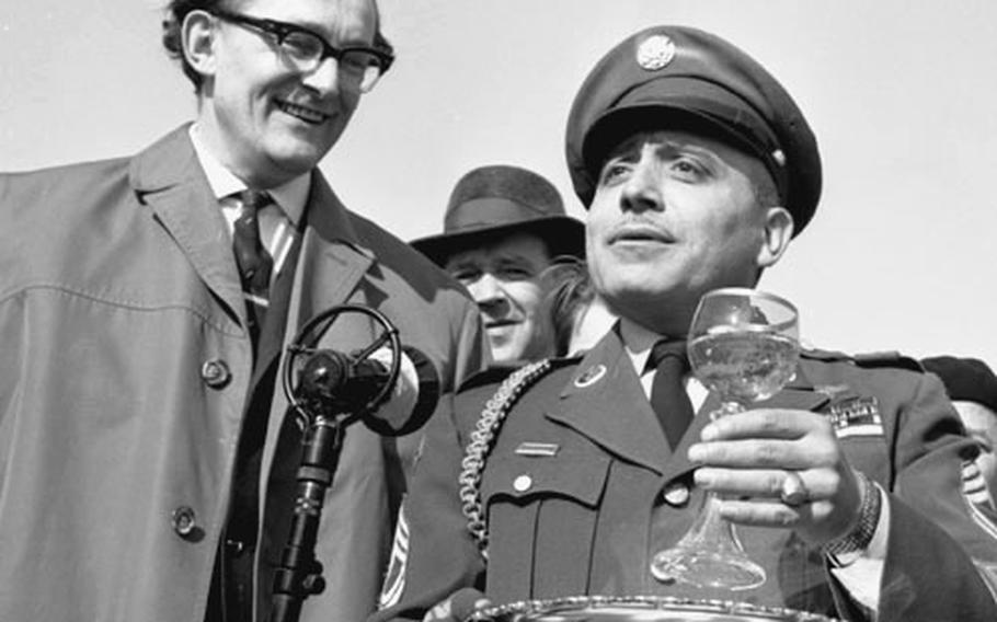 Army Sfc. Joseph A. De Lisio offers a toast.