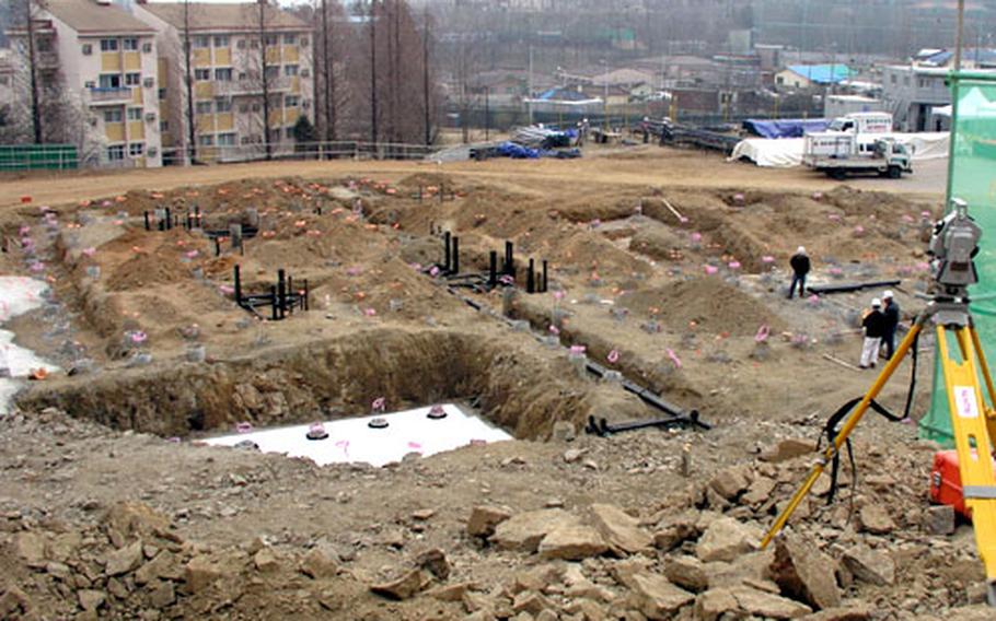Construction continues on a new nine-story family housing tower the U.S. Air Force is building outside Osan Air Base in South Korea.