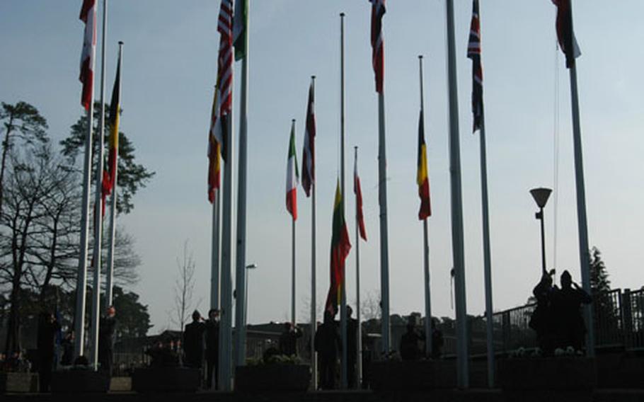 Flags from NATO's seven new members are raised Friday during a ceremony at NATO's Allied Air Forces North headquarters on Ramstein Air Base, Germany.