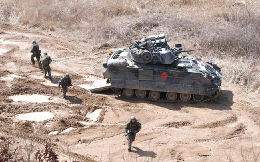 A Company soldiers and Bradley Fighting Vehicles in action at Rodriguez Range Tuesday.