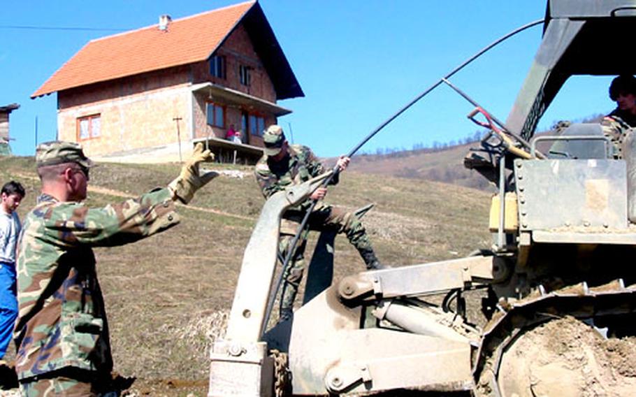 Soldiers from the 682nd Engineer Battalion of the Minnesota National Guard put a water pipeline in the ground for residents in the village of Besici, Bosnia and Herzegovina.