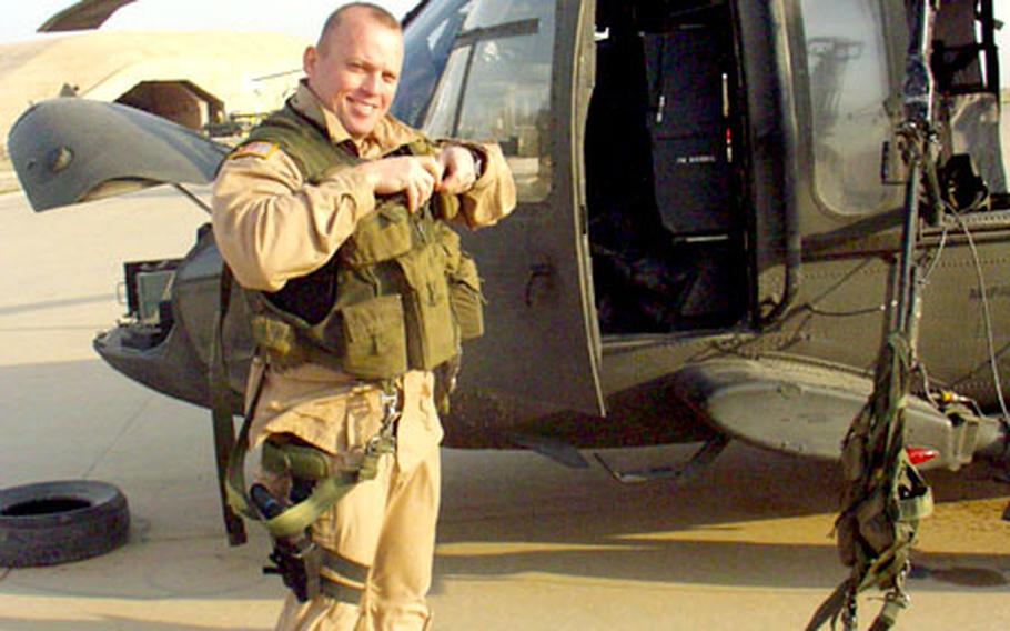 Lt. Col. Robert Werthman, commander of the 3rd Battalion, 158th Aviation, prepares on March 19 for the unit's last mission from Balad, Iraq. Most of the unit's 350 soldiers have returned to their home base in Giebelstadt, Germany, in the past two weeks after a 13-month tour that was extended by the Pentagon.