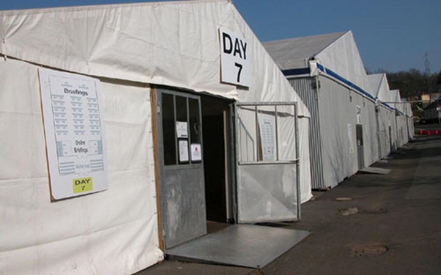 Tents were set up several weeks ago in Baumholder, Germany, for the seven-day reintegration program that soldiers from the 1st Armored Division must go through upon their return from Iraq. The soldiers won't be reintegrating for a while; the Pentagon has extended their yearlong stay by four months.