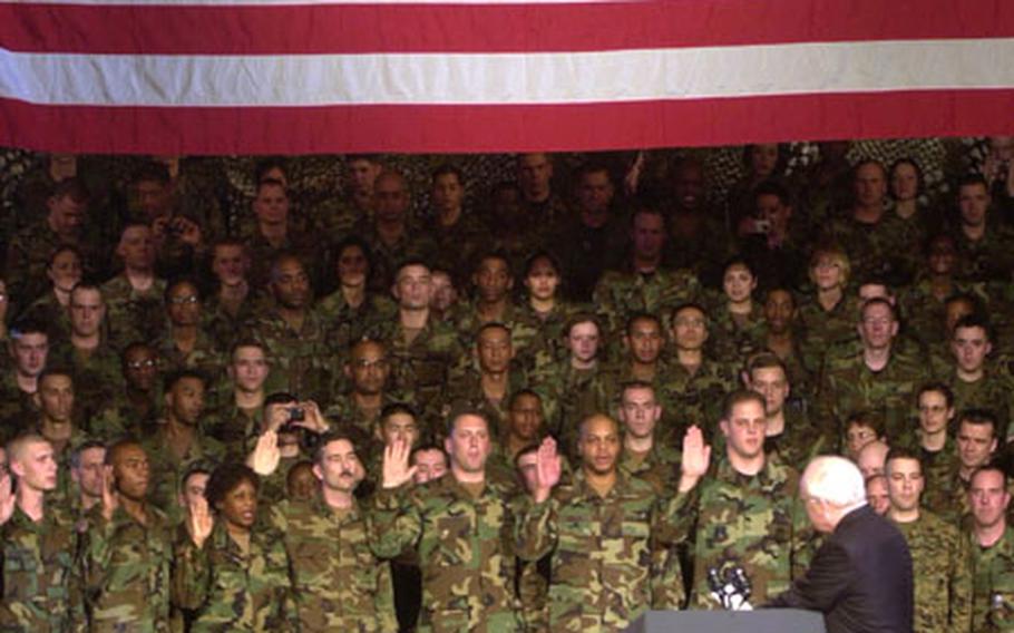 Vice President Dick Cheney re-enlisted 11 soldiers during a visit Friday to Collier Field House at Yongsan Garrison. Cheney praised South Korea's contributions to military operations in Iraq and Afghanistan while vowing to fight terrorism in those countries.