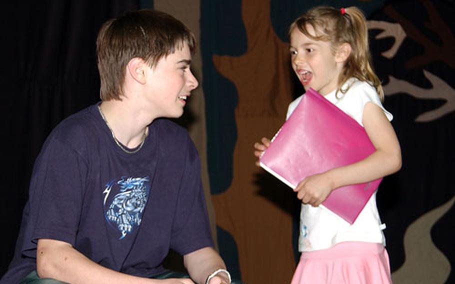 Baby Hood, played by Jenna Eidem, right, encounters the Locksmith, played by Isaiah Hickman, during a rehearsal of the Missoula Children's Theater production of "Red Riding Hood" Thursday at Wiesbaden Middle School.