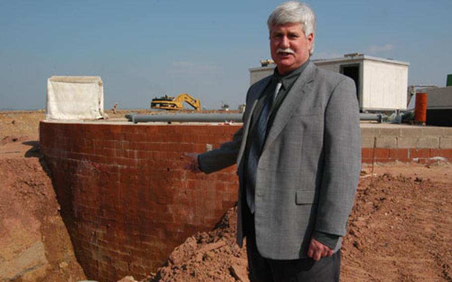 Pete Neukom, chief of Spangdahlem&#39;s Rhein-Main Transition Program, stands near a new 3.5-million gallon fuel storage tank at the air base. By the end of 2005, all military aircraft operations will move from Rhein-Main Air Base to Spangdahlem and Ramstein.