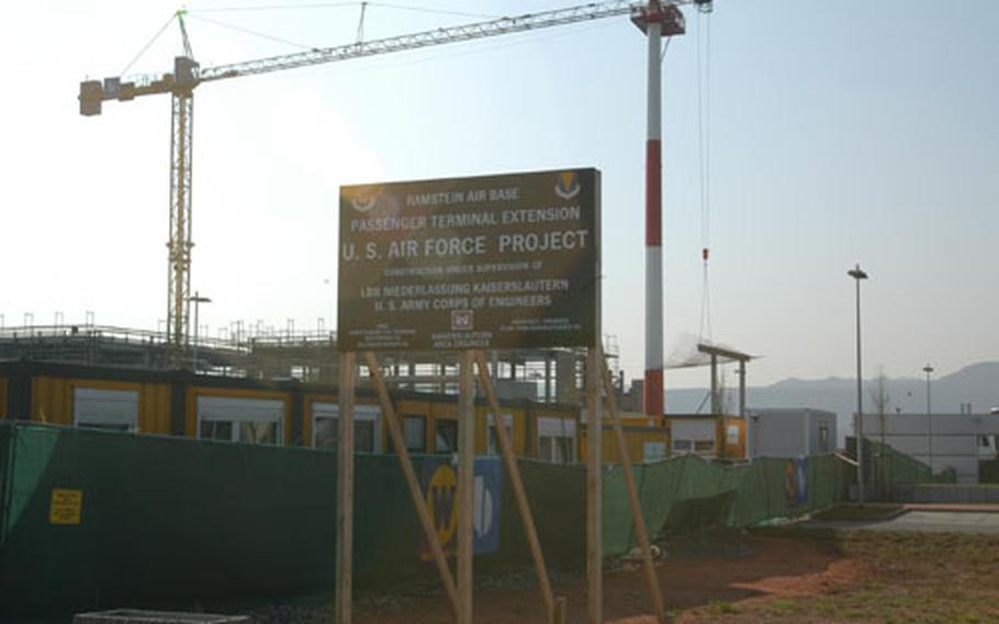 Construction girders rise above the flight line at Ramstein Air Base, Germany, where a passenger terminal annex is being built. The annex and other projects on Ramstein must be complete by the end of 2005, when Rhein-Main Air Base near Frankfurt closes.