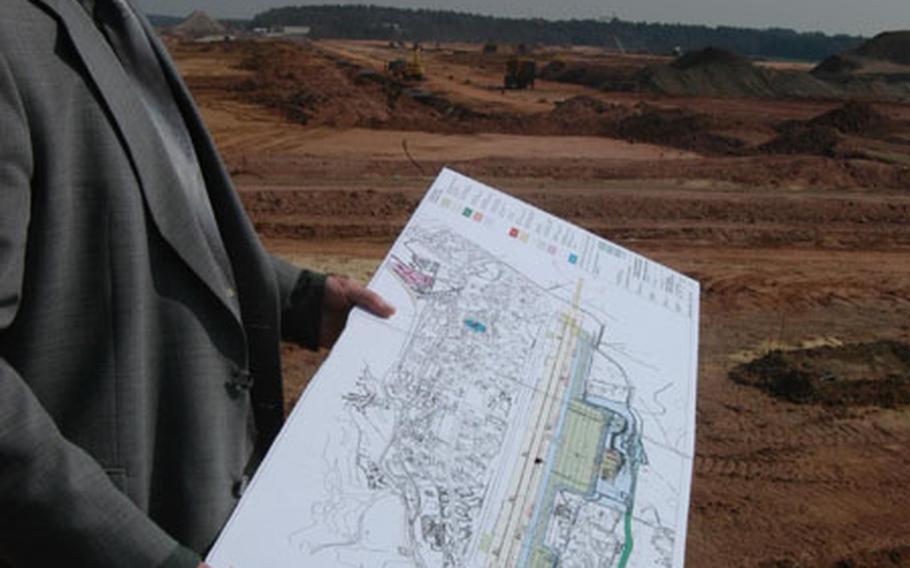 Pete Neukom, chief of Spangdahlem Air Base&#39;s Rhein-Main Transition Program, shows the map location of a massive aircraft parking ramp under construction at the base. By the end of 2005, all military aircraft operations will move from Rhein-Main Air Base near Frankfurt to Spangdahlem and Ramstein.