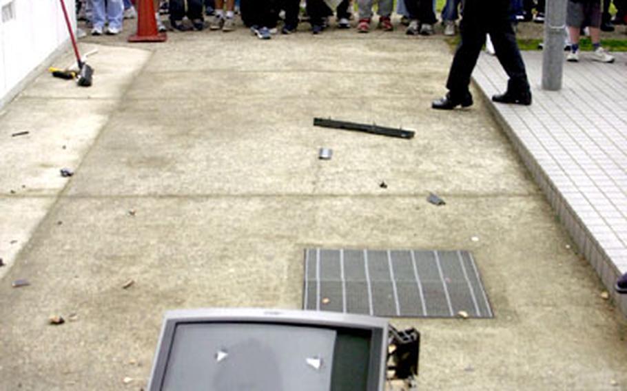 Students view the wreckage.