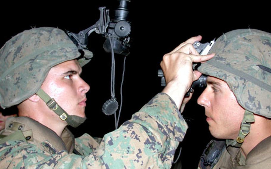 Instead of dropping mortar rounds, Cpl. Stephen Goodall, left, and Sgt. Christopher Rosetti from Weapons Company, 3rd Battalion, 8th Marines have been conducting foot and vehicle patrols through city streets in Haiti.