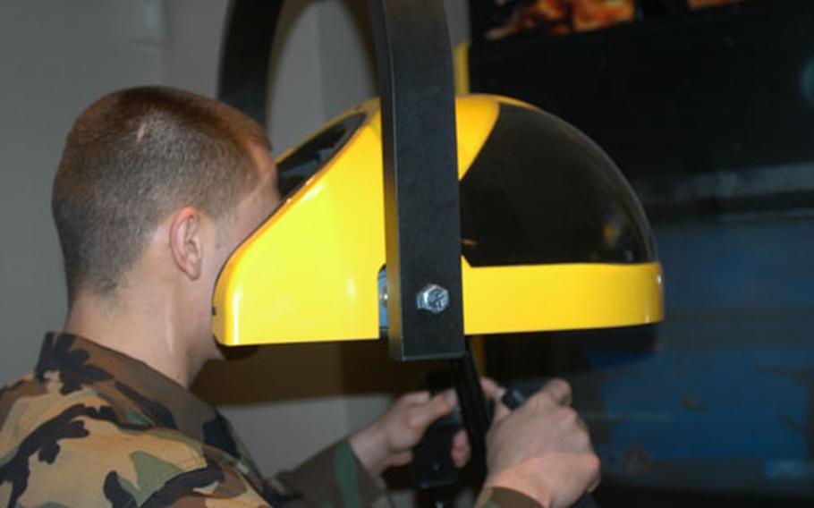 Airman 1st Class Kevin Maloney at Misawa Air Base, Japan, checks out a new virtual reality video game at the Mokuteki Community Center on Thursday. The center received $1.25 million for new gaming equipment and overall renovations. It closed Feb. 9 and was to reopen Friday morning.