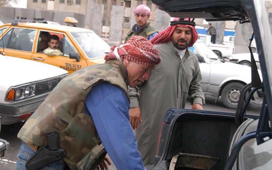 The Iraqi police corps — like these shown searching a car in Mosul in March — have come under fire lately for their poor performance in places, such as Fallujah. U.S. officials have called their actions "a major disappointment."