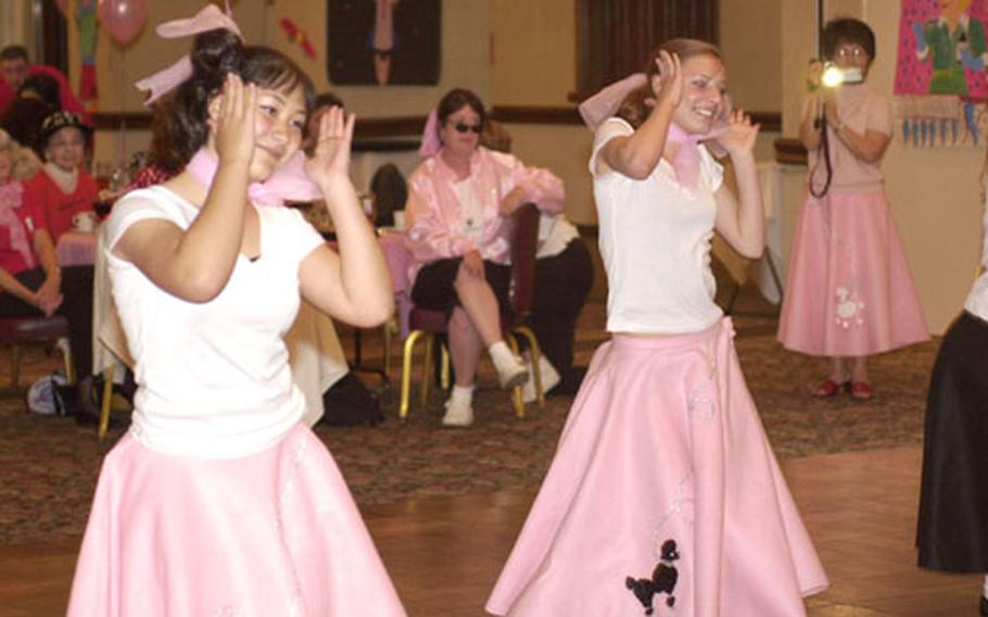 Zama American High School cheerleaders perform 1950’s dances for the Zama Officer and Civilian Spouses Association at the “Thank You Sock Hop” at Camp Zama.
