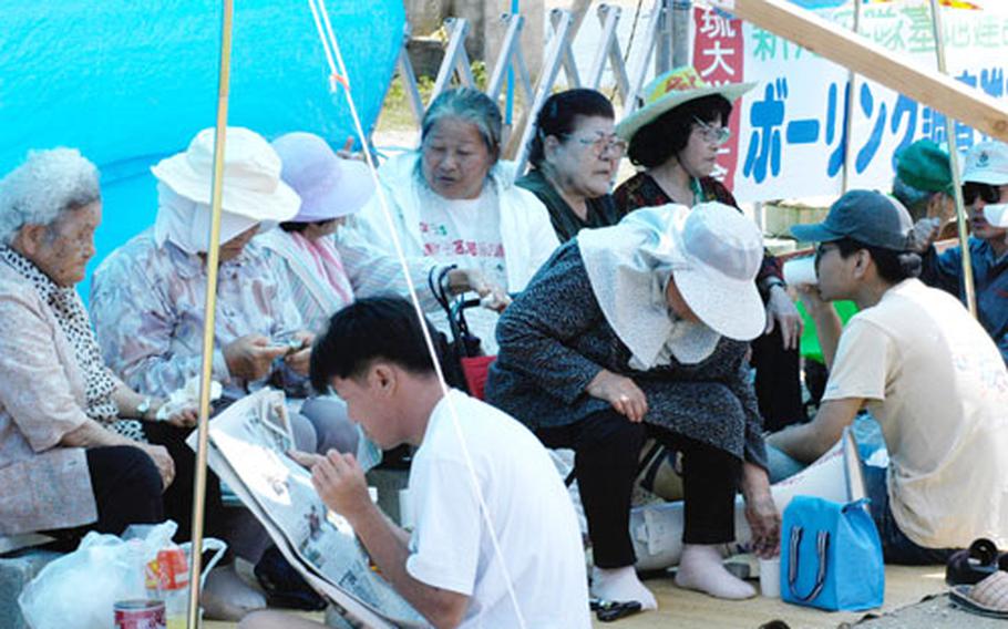 Encamped at the Henoko fishing port in opposition to an environmental survey for a new Marine air station, elderly residents and activists remained diligent at the site, vowing to prevent any work to begin.