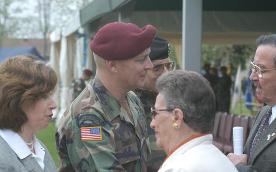Maj. Gen. Thomas R. Turner and his wife, Susan, say their goodbyes to a long line of people Friday following a change-of-command ceremony at Caserma Ederle in Vicenza, Italy.