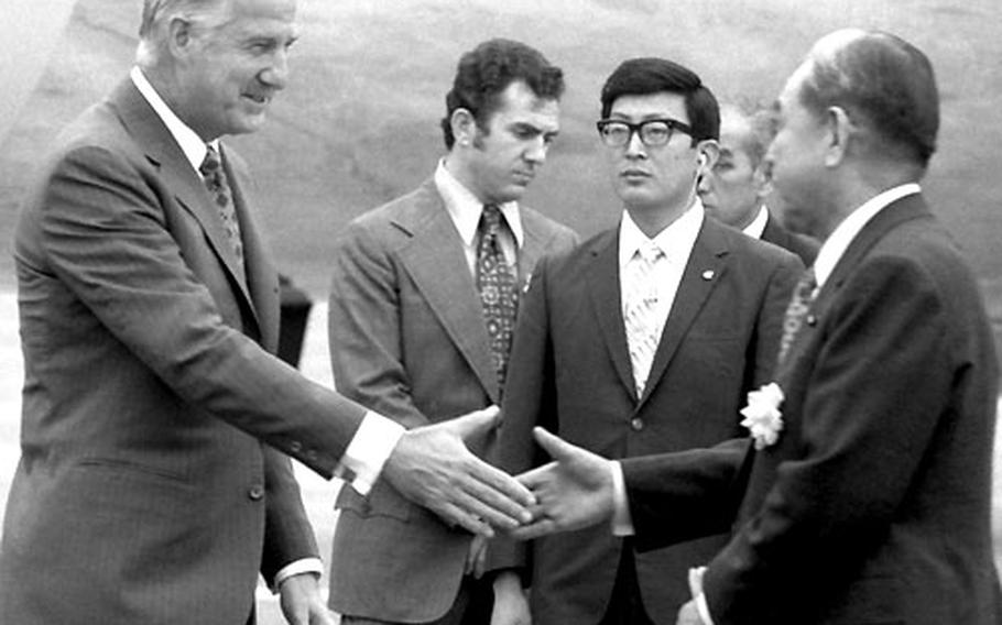 Arriving in Tokyo in August, 1972, Vice President Spiro Agnew shakes hands with Japanese Prime Minister Eisaku Sato.