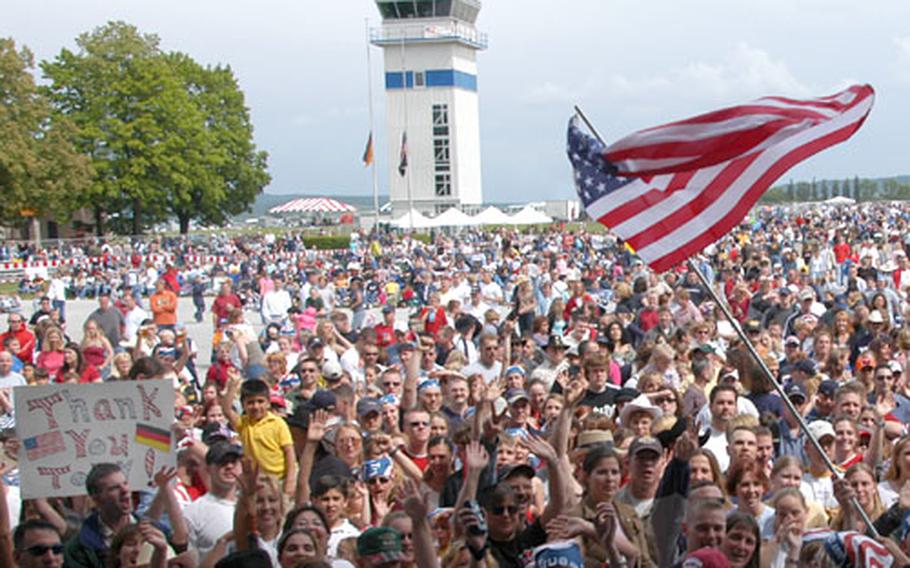 Fans cheer Monday as the start of the free Toby Keith/Ted Nugent Memorial Day concert near in Illesheim, Germany in on May 31, 2004.