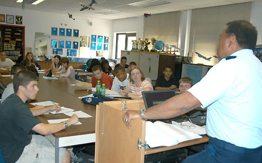 Junior ROTC students at Ramstein High School in Germany, shown here with teacher Master Sgt. Thomas Speller, learn about the invasion of Normandy as part of their studies.