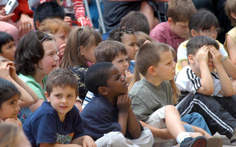 Gaeta Elementary School pupils listen to faculty members talk about the school during a celebration Wednesday marking its 30th birthday.