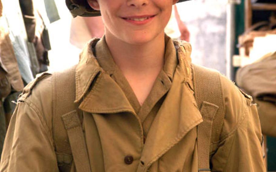 Enthusiasts of all ages get into the act at the 60th anniversary of D-Day at Normandy. Even kids dressed up in World War II-style uniforms to celebrate the occasion.