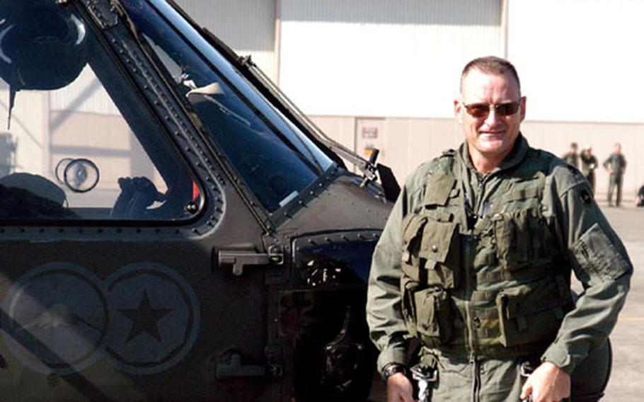 Lt. Col. David P. Rodgers, commander of the 78th Aviation Battalion at Camp Zama, Japan, stands beside his Blackhawk helicopter Monday after his final flight. This week, he leaves the battalion to assume a grounded staff position at U.S. Army Garrison Japan.