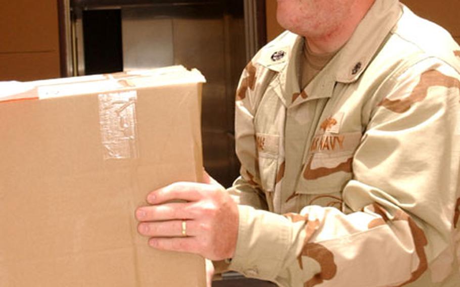 Builder Chief (SCW) Scotty Arias moves safety supplies to the Bahrain-based headquarters of Commander, U.S. Naval Forces Central Command/ Commander, U.S. Fifth Fleet. Arias serves as the Navy's safety chief for the entire AOR, and is only the fifth amputee in U.S. Navy history to be medically cleared to serve on active duty.