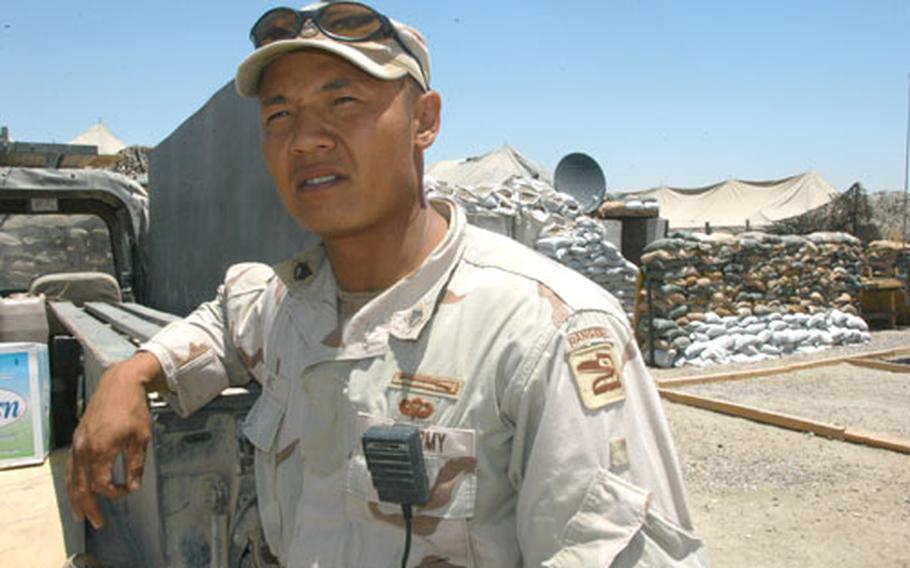 Staff. Sgt. Nate Hays stands beside the spot where his friend Spc. Daniel Unger was killed by a mortar at Camp Kalsu, Iraq.