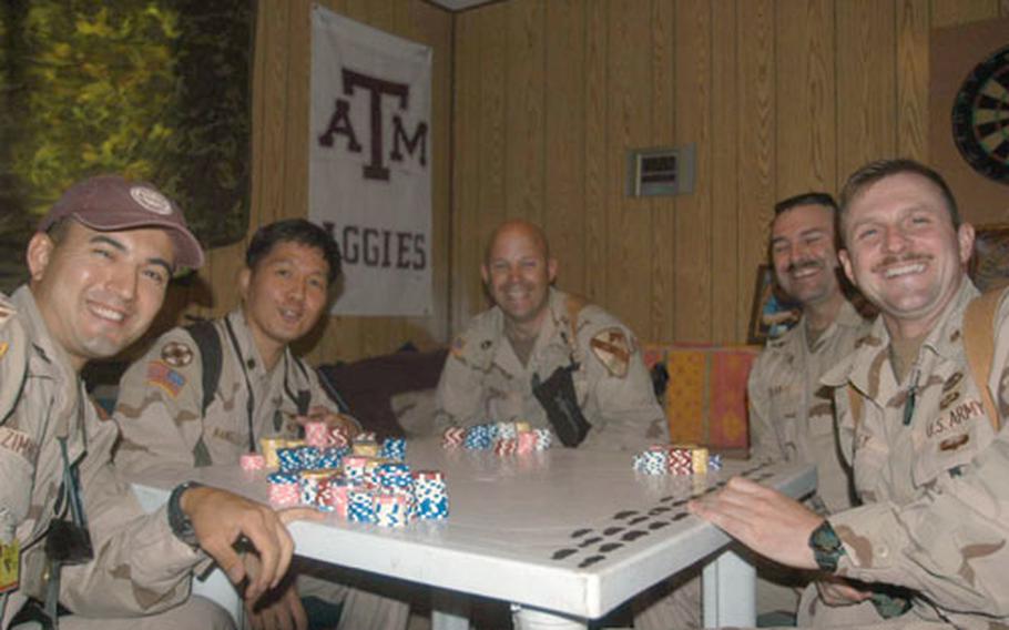 Rounders from Headquarters and Headquarters Company, 1st Cavalry Division's surgeon section in Baghdad said playing poker helps them work together better as team, as well as releases stress from demanding work hours while deployed.