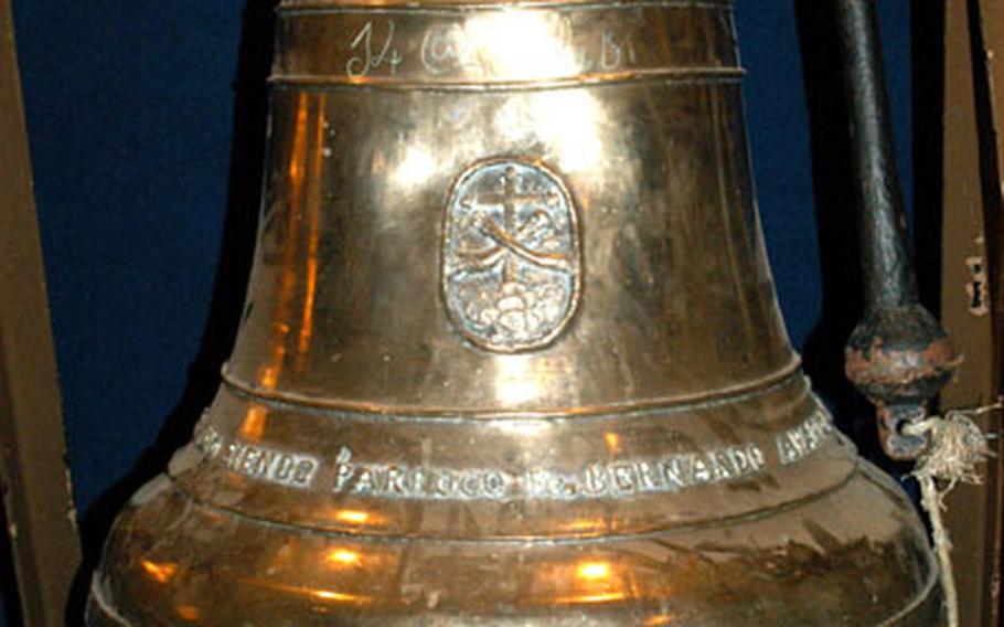 The history of the Balangiga Bell, seen on display at at the 2nd ID Museum at Camp Red Cloud, South Korea in 2004, is under debate. The 2nd ID claims townspeople presented it the bell in 1902, while a new book says U.S. troops seized the bell after burning the town.