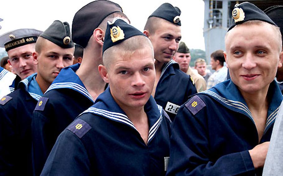 Sailors with the Russian Naval Fleet stand in line for hot dogs and hamburgers on Sunday during a U.S. Independence Day barbecue in Vladivostok, Russia. Several hundred Russian sailors and marines joined U.S. troops assigned to the Vladivostok Port Visit Detachment to celebrate the holiday.