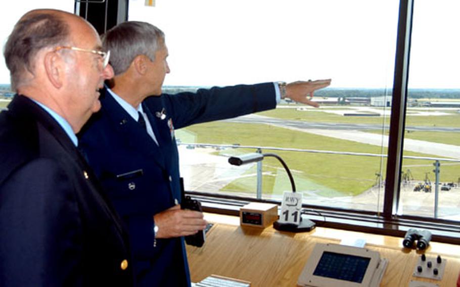 Lt. Col. Rich Cordell, right, deputy commander of the 100th Operations Group at RAF Mildenhall, England, shows off the base's new tower to David Hastings, an honorary commander at the base.