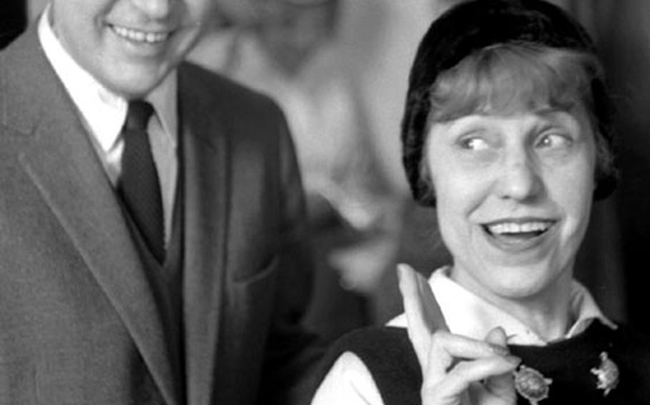 Actress Lotte Lenya and husband Russell Detwiler, an impressionist painter from Philadelphia, stop at Rhine-Main on their way from Berlin to New York in January, 1963.