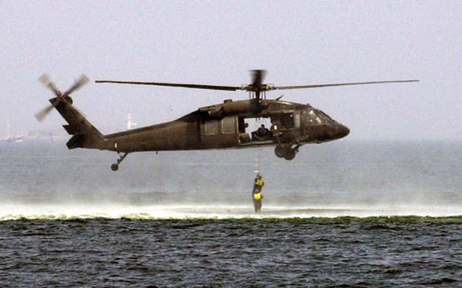 Soldiers of the 78th Aviation Battalion from Camp Zama trained in helicopter ditching and swimmer extraction off Yokosuka Naval Base Thursday.