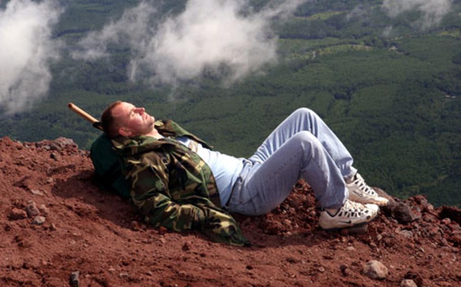 Welcome Marine Program participant Staff Sgt. Claude G. Gillman catches some quick shuteye during a break from descending Mt. Fuji on July 18. Gillman is a C-130 flight engineer with the 1st Marine Aircraft Wing on Marine Corps Air Station Futenma.